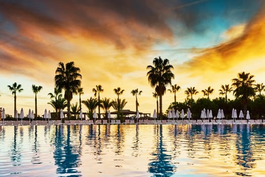 Sunset on the background of the pool                                 