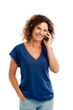 Beautiful young woman with mobile phone making a phone call