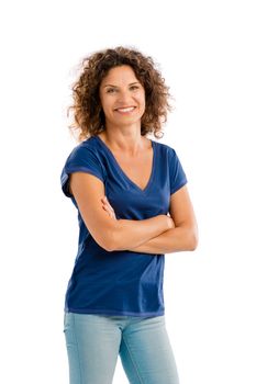 Smiling middle aged woman with arms folded, isolated on white background