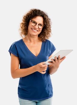 Beautiful middle aged woman working on a tablet