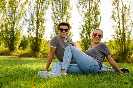 Portrait of a happy young couple enjoying a day in the park together