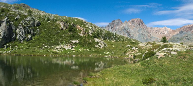 Small lake on the Italian alps in Valmalenco
