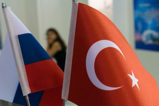 Flags of Russia and Turkey in the office and silhouette