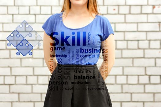 skill concept. photo for your design. girl in blue near a white brick wall