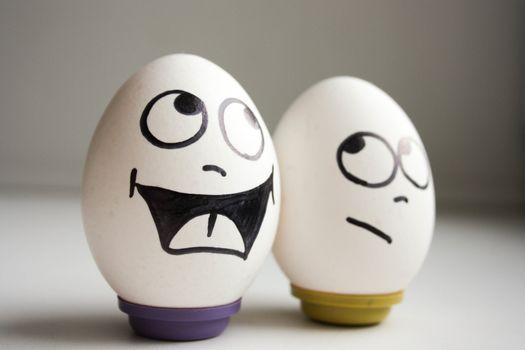 funny and funny eggs. two eggs for Halloween. smiling. photo for your design