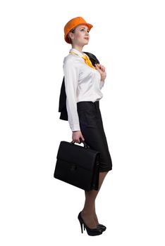 Young female engineer with suitcase in hardhat isolated on white