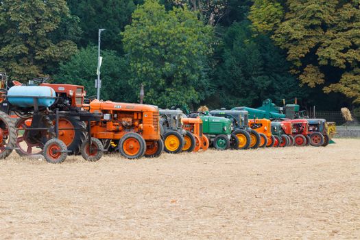 Detail of old tractors in perspective, agricultural vehicle, rural life