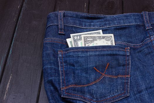 Some dollars in a pocket of jeans