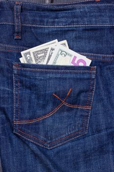 Some dollars in a pocket of jeans