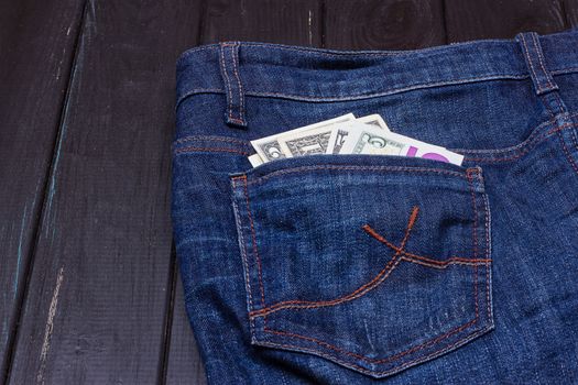 Some dollars in a pocket of jeans