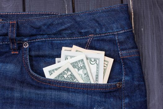 Some dollars in a pocket of jeans
