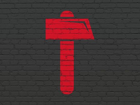 Constructing concept: Painted red Hammer icon on Black Brick wall background