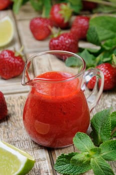 Strawberry fresh sauce with mint and lime. Vertical shot. 