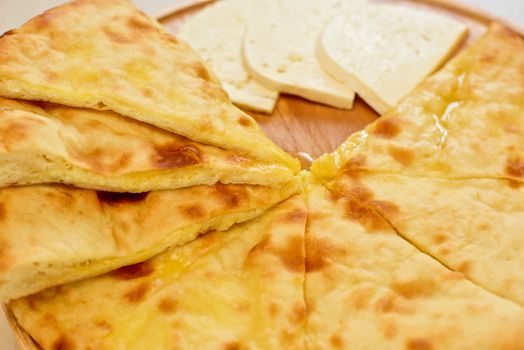 ossetian pie with cheese on a white background