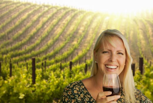 Attractive Young Woman With Wine Glass in A Vineyard.