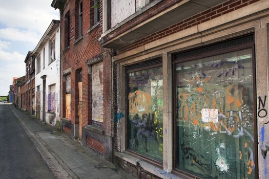 Street in ghost town Doel in Belgium