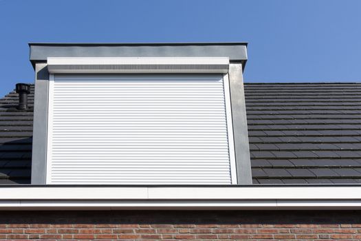 Dormer window with rolling safety  shutter in the Netherlands