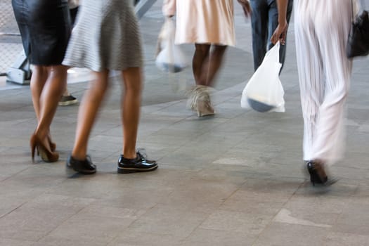 Well dressed motion blurred women in a city in the Netherlands