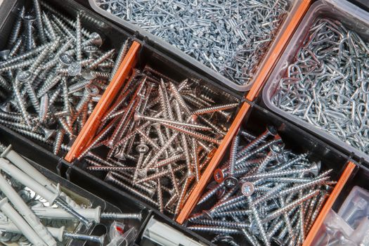 Close-up of screws and nails in a box