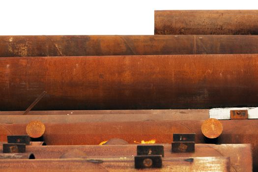 Stack of industrial reusable rusty metal pipes