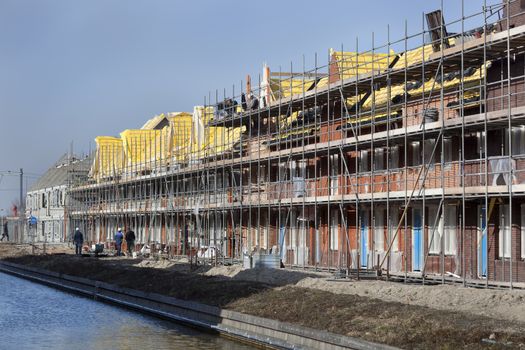 Residential construction site with some workers in Berkel in the Netherlands