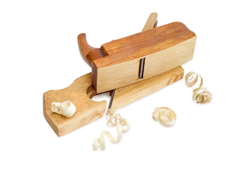 Two old wooden hand planes different purposes and shavings on a white background
