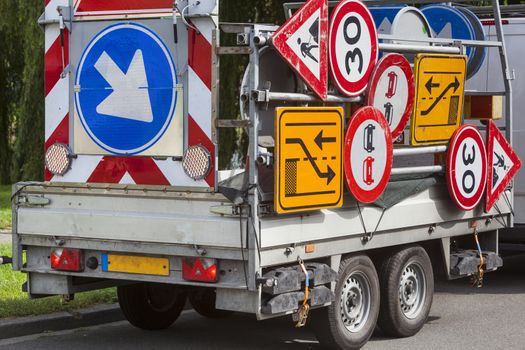 Confusing traffic signs on a trailer in the Netherlands