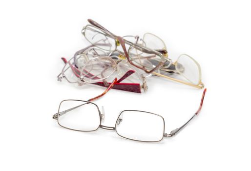 Modern classic men's eyeglasses against of old glasses