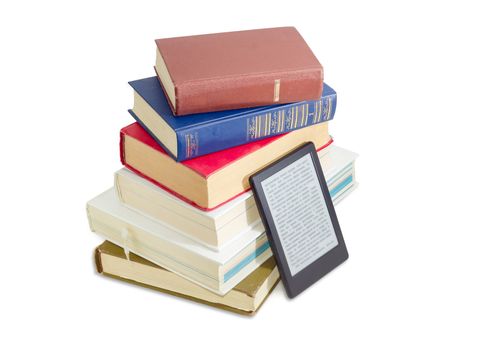 Ebook reader near of a stack of ordinary paper books on a white background
