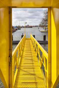 Yellow ship gangway in Rotterdam in the Netherlands