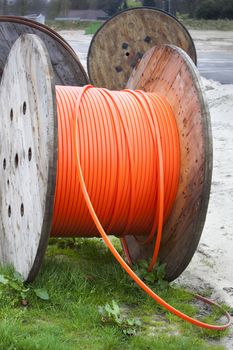 Industrial spools with orange cable in the Netherlands