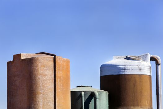 Old weathered vintage storage tanks of a farm