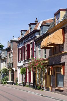 Cozy vintage street with roses in Culemborg in the Netherlands