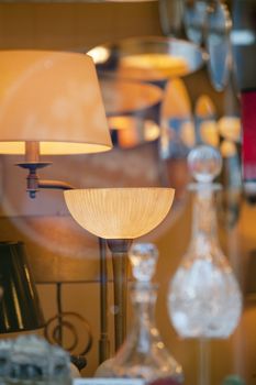 Lamps, mirrors and carafes in a store