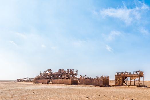 The rusted remains of an abandoned oil drilling rig between Henties Bay and Torra Bay in the Skeleton Coast area of Namibia