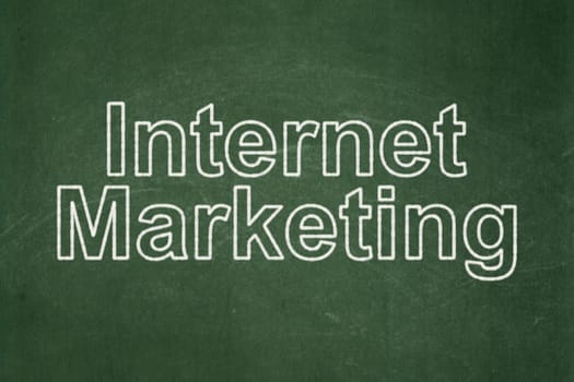 Advertising concept: text Internet Marketing on Green chalkboard background