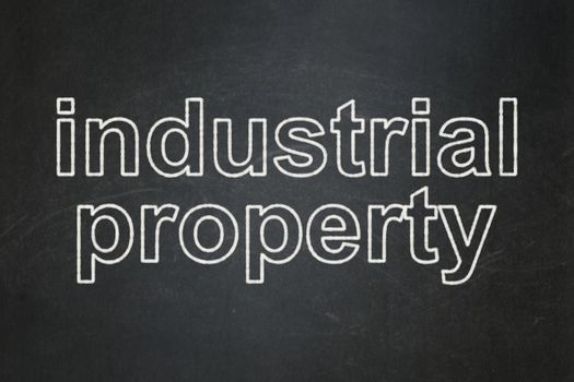 Law concept: text Industrial Property on Black chalkboard background