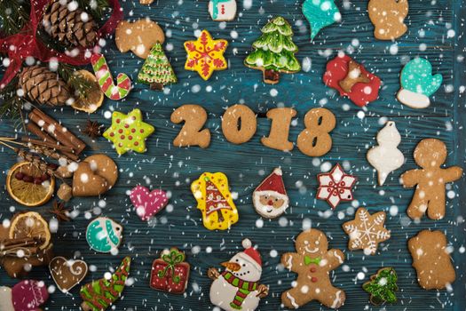 Gingerbreads for new 2018 year on wooden background, xmas theme