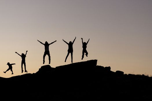 happy and cheerful people group in the nature