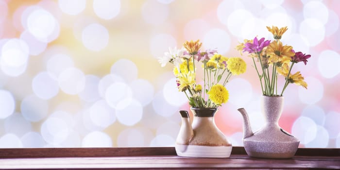 vintage photo of flowers in ceramic potted on bokeh for background, image of floral 