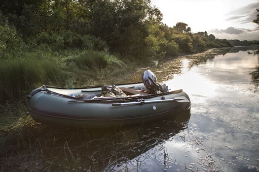 inflatable boat with a motor in the Gulf of river