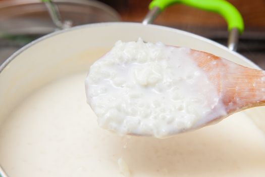 Rice Pudding with cinnamon and raisins preparation : Cooked rice with added milk