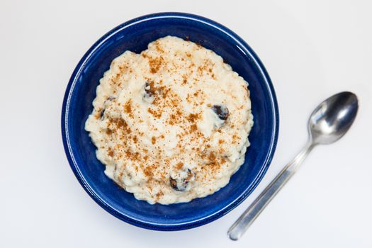 Rice Pudding with cinnamon and raisins preparation : Ready served sweet rice pudding