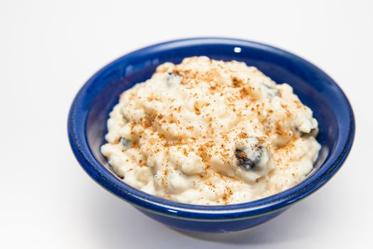 Rice Pudding with cinnamon and raisins preparation : Ready served sweet rice pudding