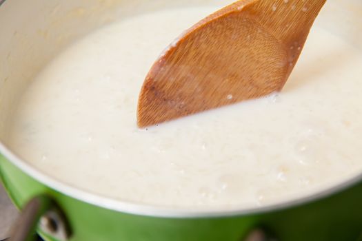 Rice Pudding with cinnamon and raisins preparation : Cooked rice with added milk