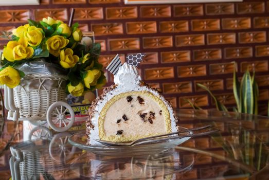 Cake icecream on glass plate with brick wall background