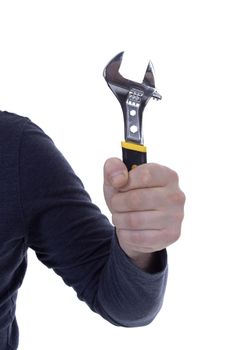 Male hand holding an adjustable wrench on white background