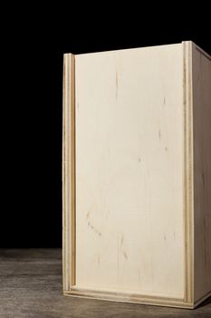 Light wooden boxes on a dark background