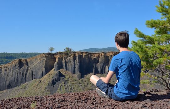 Teen boy alone enjoy mountain view