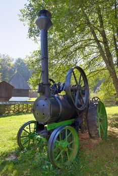 Old fashionned  thresher in small village